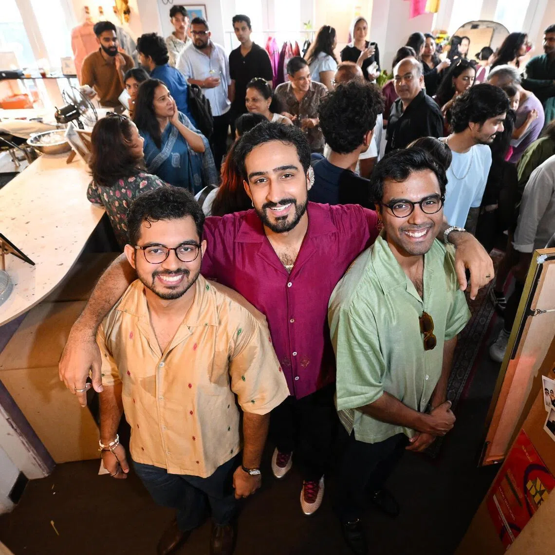 The Dori co-founders Ajinkya Kulkarni, 27, Rishabh Sharma, 27, and Laavanya Kejriwal, 27, with customers at One Trick Pony bar on July 19.
