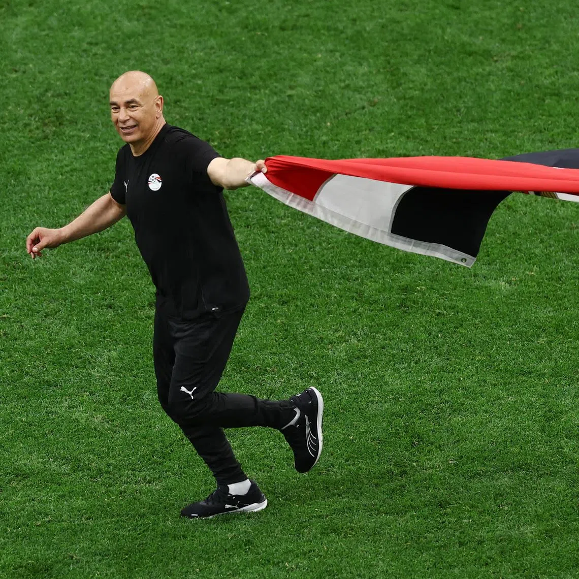 Egypt coach Hossam Hassan celebrates his side's 3-1 comeback win over New Zealand.