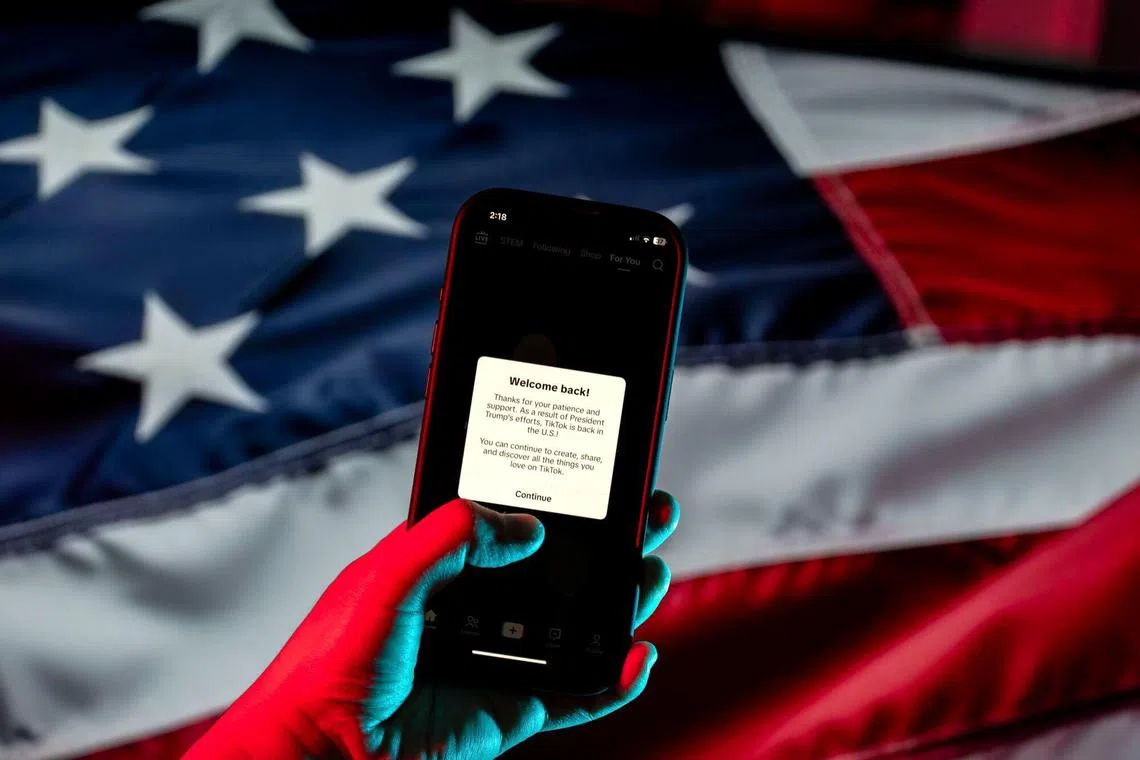 A message welcoming users back and thanking US President-elect Donald Trump on the TikTok app on a smartphone arranged in Arlington, Virginia, US, on Sunday, Jan. 19, 2025. TikTok started restoring service in the US on Sunday, after a whipsaw of events that saw the video app make good on a threat to go dark, only to have Trump halt enforcement of the law and announce he would give its owners another three months to find a buyer. Photographer: Kent Nishimura/Bloomberg
