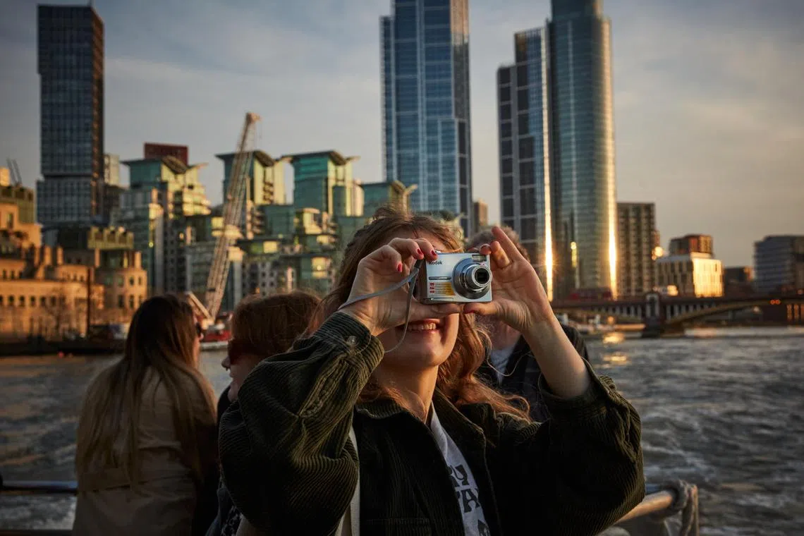 Travelers on an Uber Boat in London, March 20, 2025. Though London often winds up on lists of the worldÕs most expensive cities, budget travelers will find plenty of free museums, arresting architecture and affordable distractions, including tours and markets. (Alice Zoo/The New York Times)