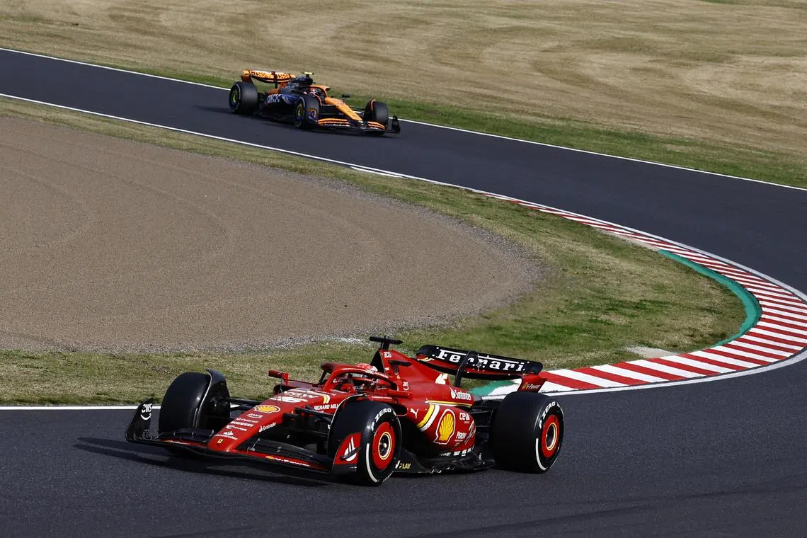 Formula One F1 - Japanese Grand Prix - Suzuka Circuit, Suzuka, Japan - April 7, 2024 Ferrari's Charles Leclerc and McLaren's Lando Norris in action during the race REUTERS/Issei Kato