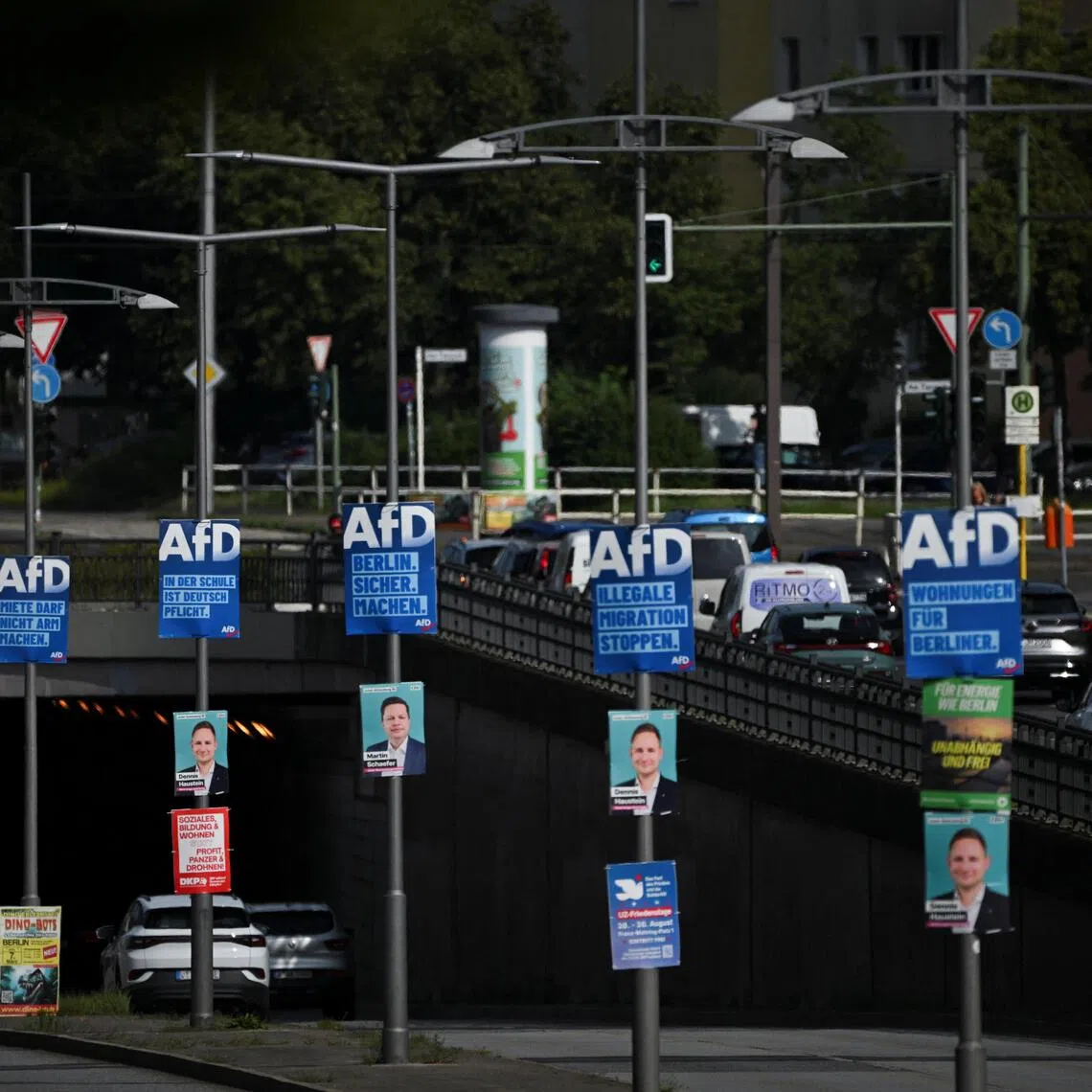Cars drive past election campaign posters of the Alternative for Germany party (AfD) for the upcoming Berlin state election, in Berlin, on Aug 3.