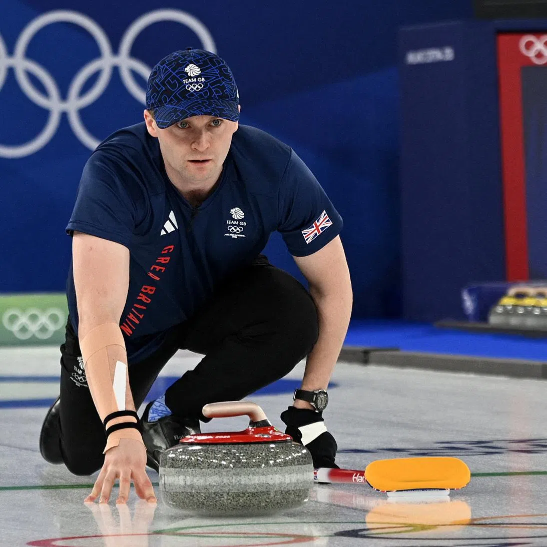 Milano Cortina 2026 Olympics - Curling - Mixed Doubles Bronze Medal Game - Great Britain vs Italy - Cortina Curling Olympic Stadium, Cortina d'Ampezzo, Italy - February 10, 2026. Bruce Mouat of Britain during a match with Jennifer Dodds of Britain against Stefania Constantini of Italy and Amos Mosaner of Italy REUTERS/Jennifer Lorenzini