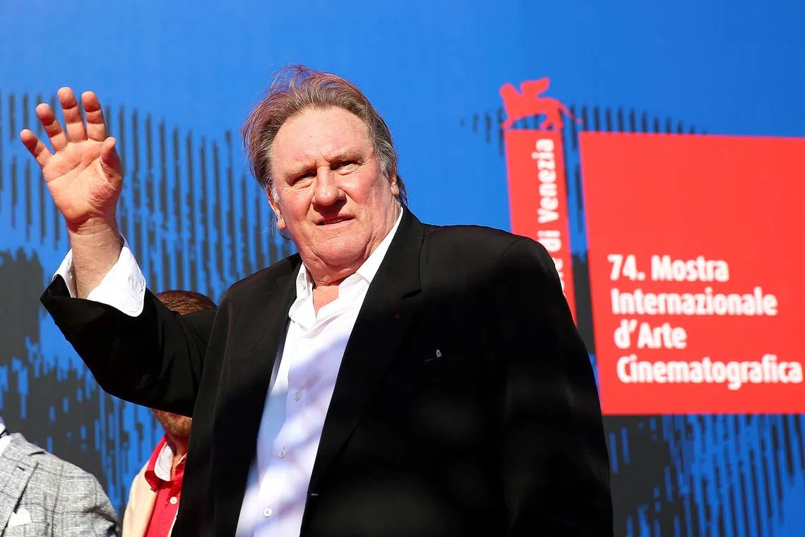 FILE PHOTO: Gerard Depardieu waves as he arrives during a red carpet event for the movie \"Novecento- Atto Primo\" at the 74th Venice Film Festival in Venice, Italy, Italy September 5, 2017.   REUTERS/Alessandro Bianchi/File Photo