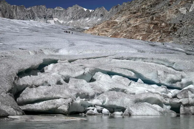 A photograph showing melt-induced crevasses on the lower part of the Rhone Glacier, above Gletsch in the Swiss Alps, on July 24, amid extreme heat.