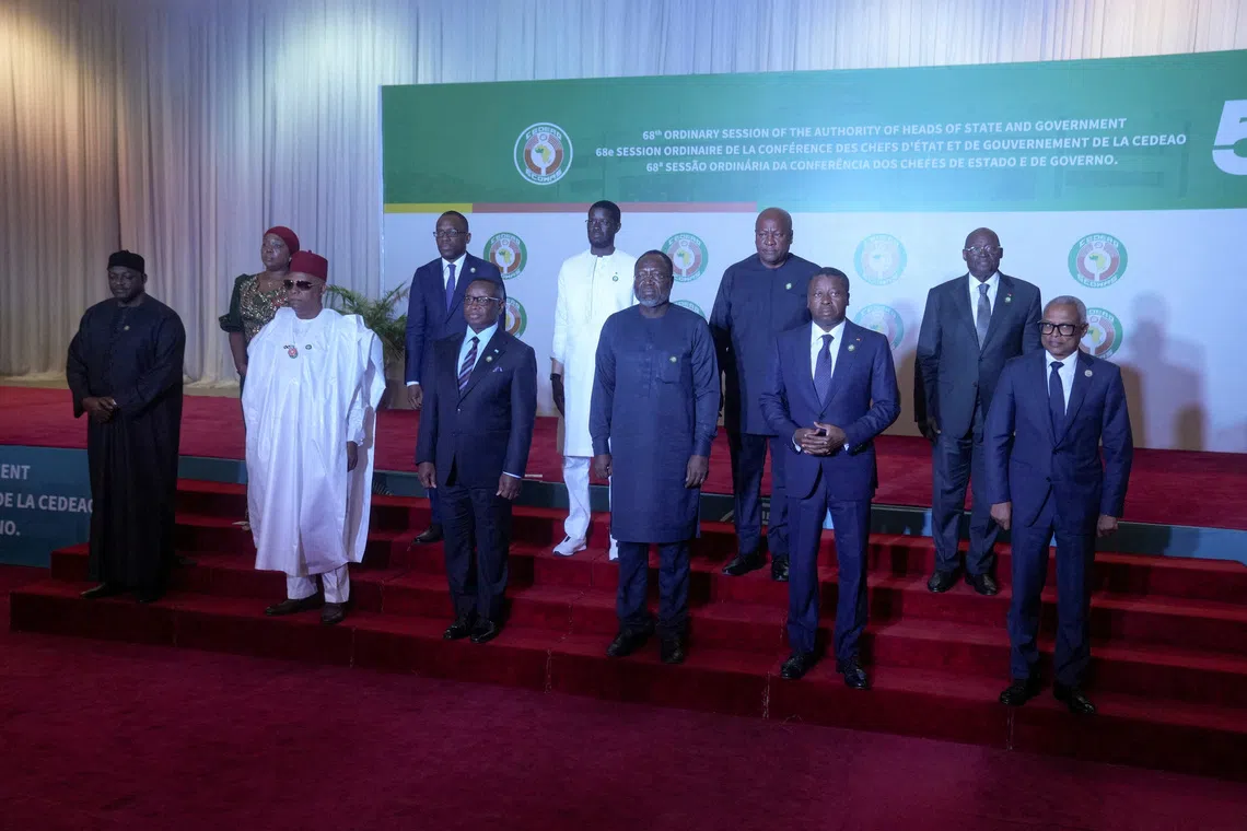 ECOWAS heads of state and representatives pose for a group photograph during the 68th Ordinary Session of the ECOWAS Authority of Heads of State and Government in Abuja, Nigeria, December 14, 2025. REUTERS/Marvellous Durowaiye