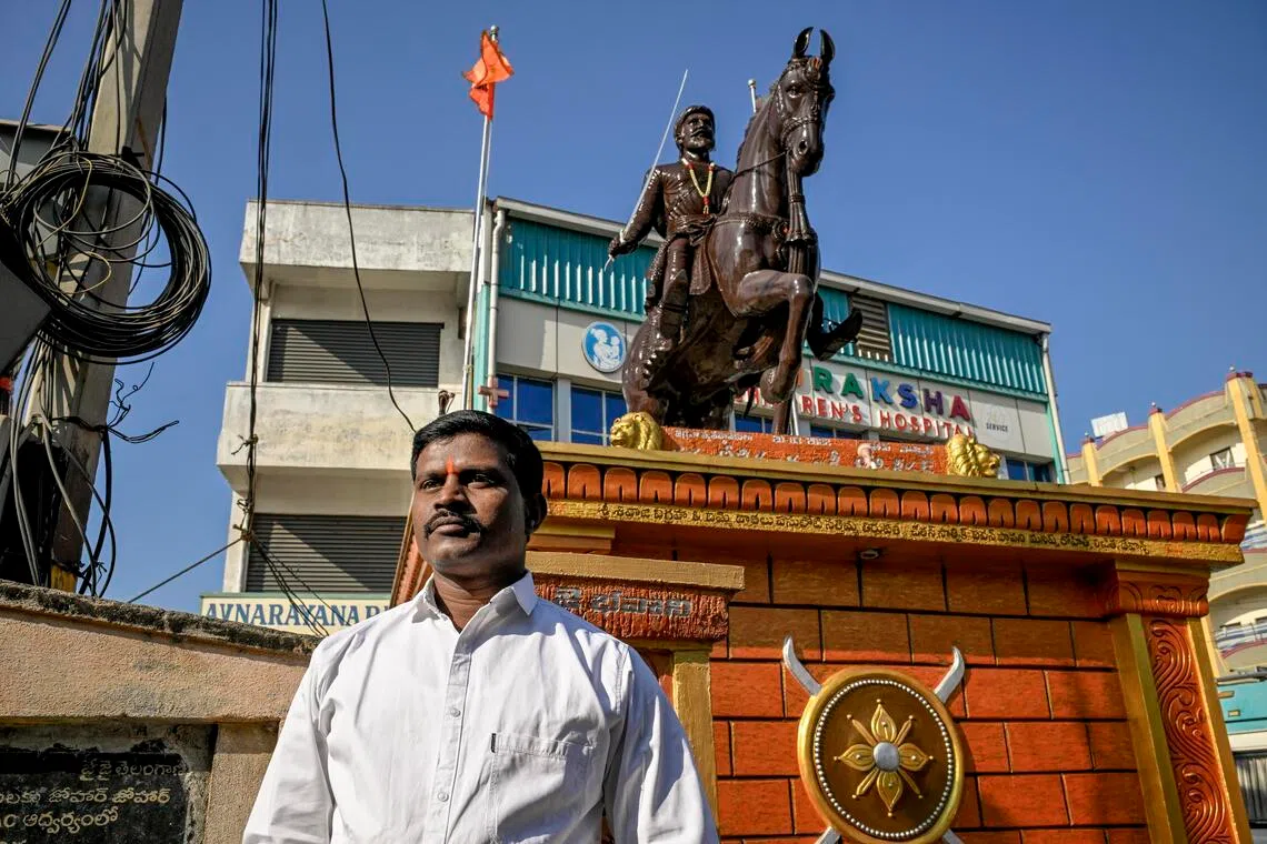 Gopi Kishan in front of the Shivaji statue in Bodhan on Jan 8. Although he got in trouble with authorities, the statue remains standing where he put it.