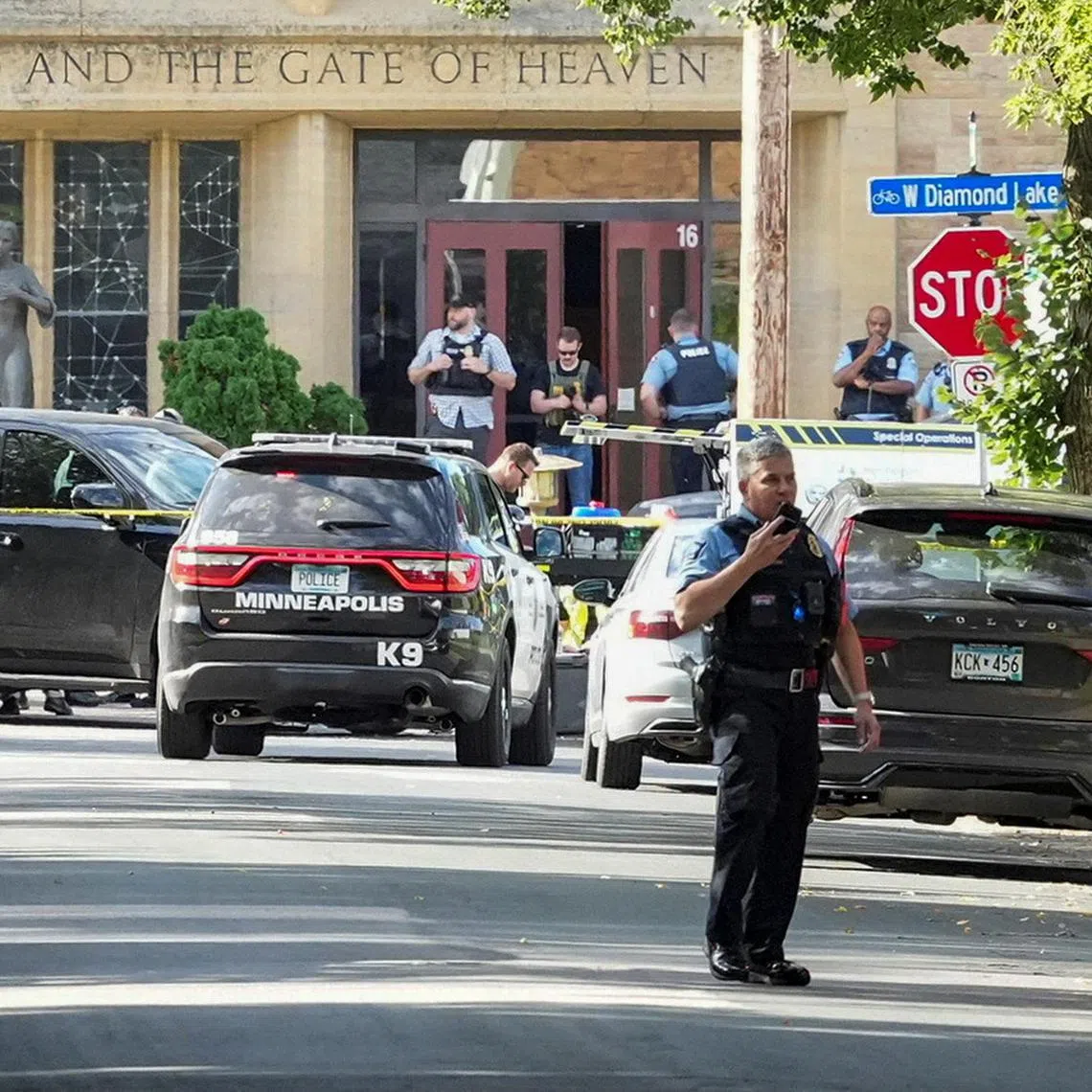Law enforcement officers gathering outside the Annunciation Church in Minneapolis on Aug 27, following a mass shooting.