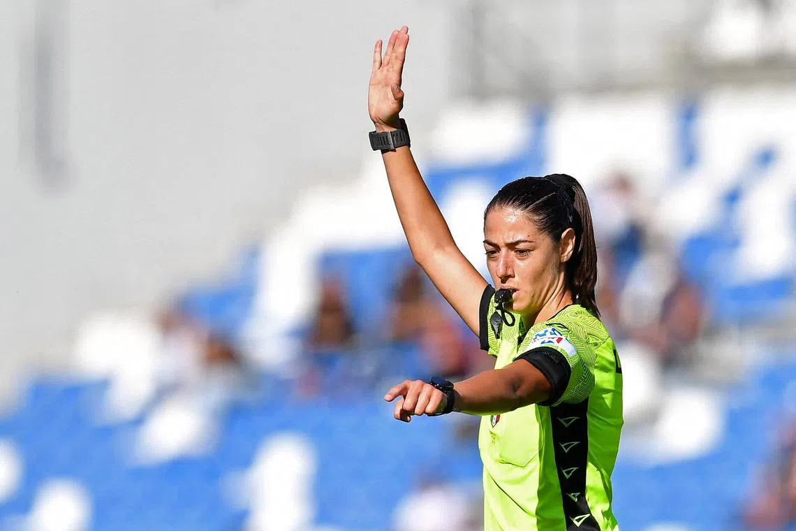 FILE PHOTO: Soccer Football - Serie A - U.S. Sassuolo v Salernitana - Mapei Stadium - Citta del Tricolore, Reggio Emilia, Italy - October 2, 2022 The first female referee in Serie A Maria Sole Ferrieri Caputi signals during the match REUTERS/Jennifer Lorenzini/File Photo