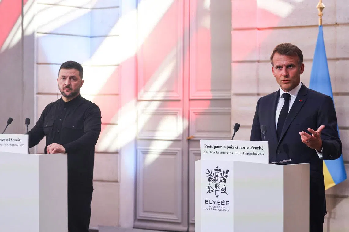 French President Emmanuel Macron (right) and Ukrainian President Volodymyr Zelensky at a press conference in Paris on Sept 4.