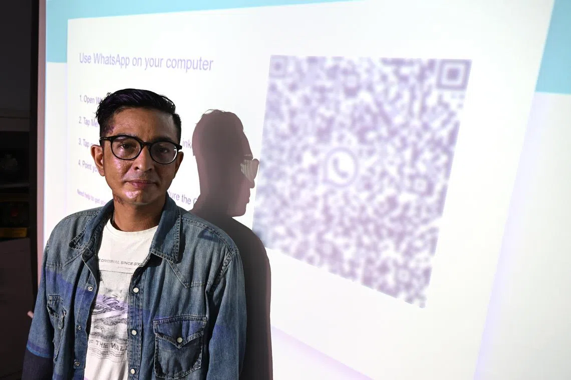 Mr Fidie, 42, who works in a construction firm, is a victim of a 'WhatsApp Web' impersonation scam. He is pictured with a fake 'WhatsApp Web' website, which allows scammers to access victims' WhatsApp accounts after they scan the QR code there.