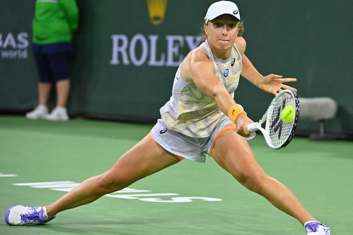 Iga Swiatek hitting a shot against Bianca Andreescu in her third round match at Indian Wells.