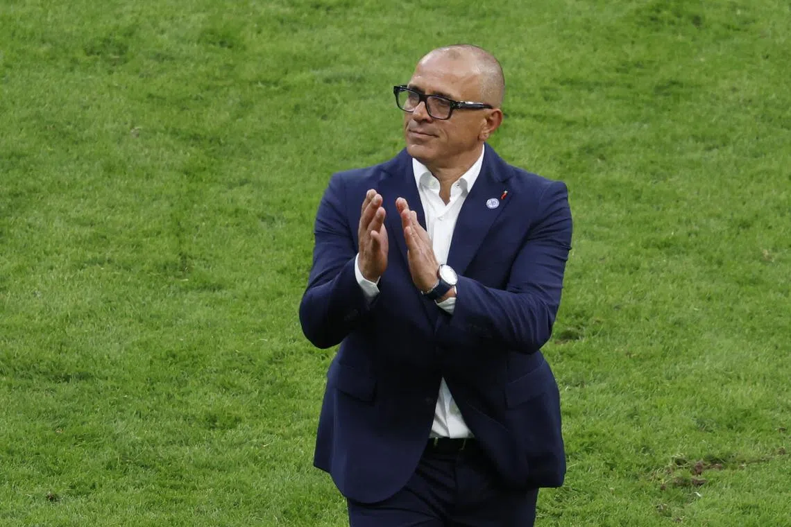 Soccer Football - Euro 2024 - Group E - Belgium v Slovakia - Frankfurt Arena, Frankfurt, Germany - June 17, 2024 Slovakia coach Francesco Calzona applauds fans after the match REUTERS/Heiko Becker