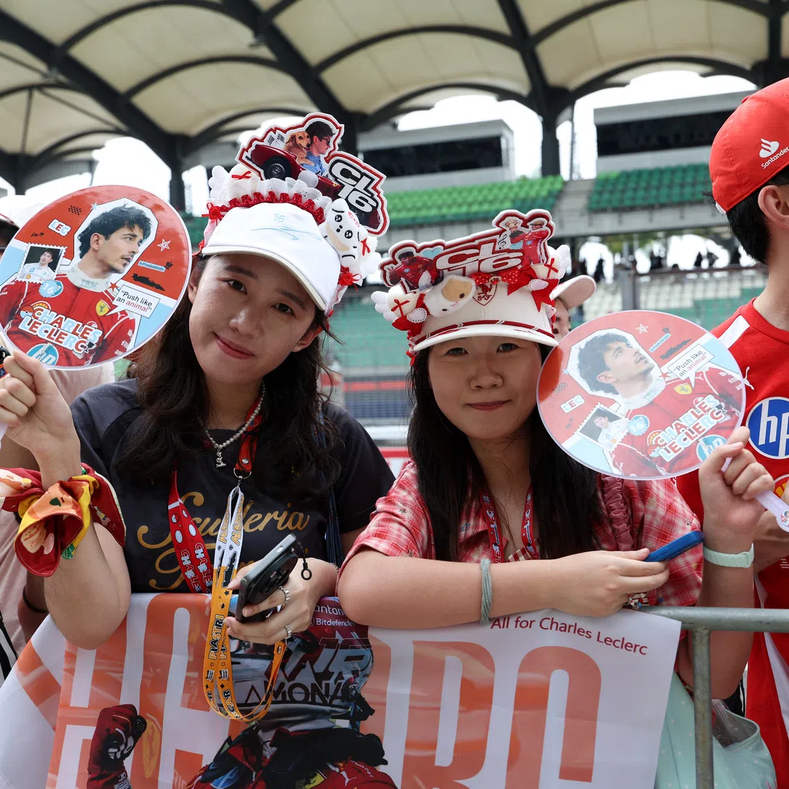Fans of Ferrari’s Charles Leclerc are seen ahead of the Bahrain Grand Prix in Sepang, Malaysia, on Oct 1.