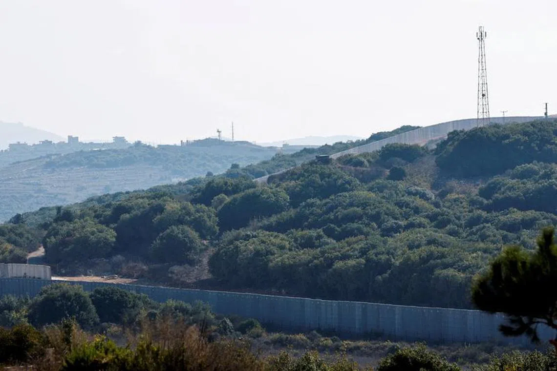 FILE PHOTO: A border wall is pictured in the town of Marwahin, near the border with Israel, in southern Lebanon, October 12, 2023. REUTERS/Thaier Al-Sudani/File Photo