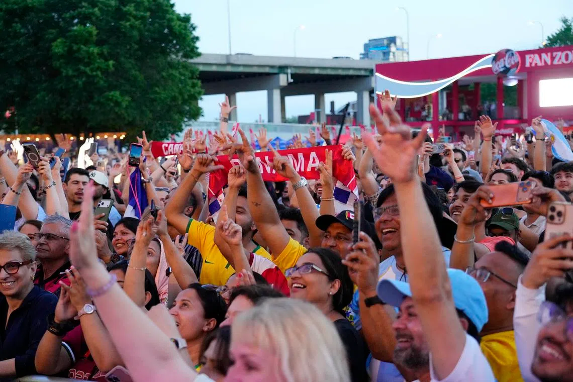 Fans cheering during the countdown concert on June 10, a day before the World Cup opened. 