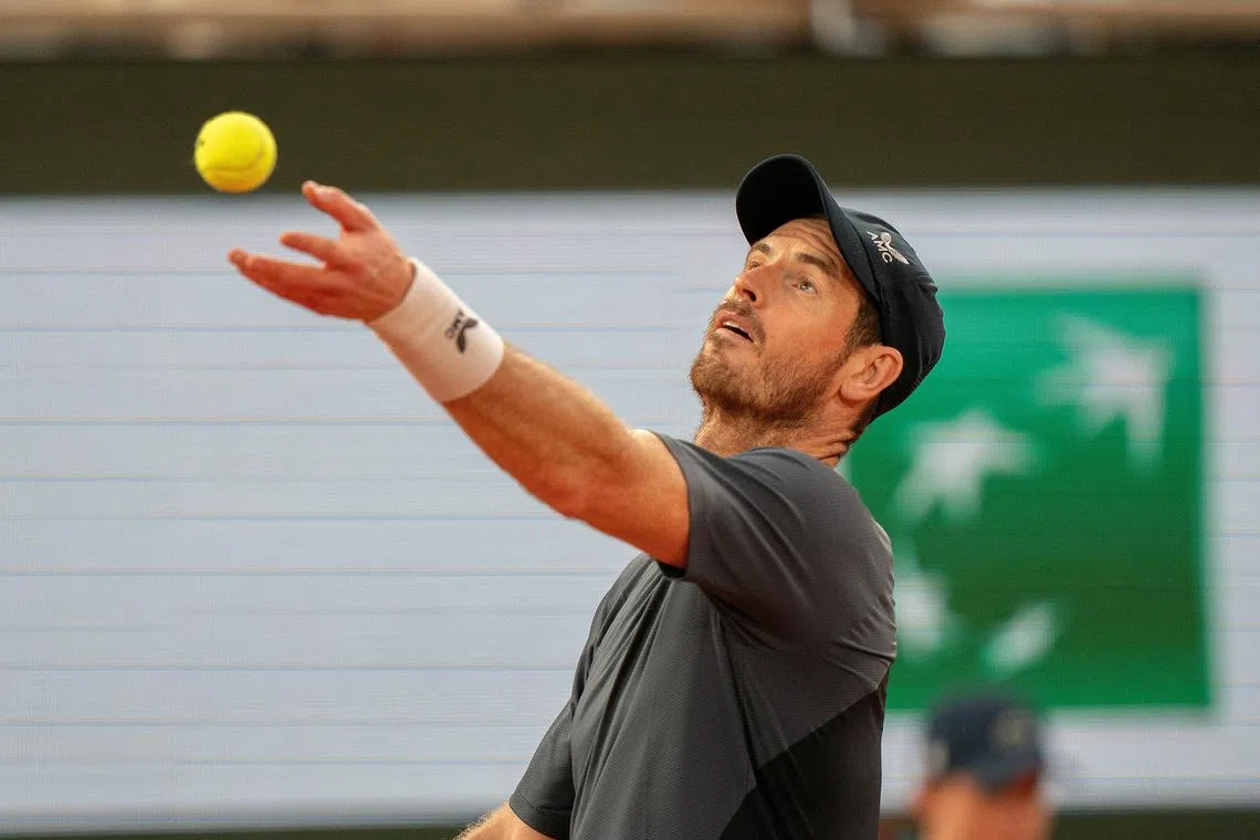 FILE PHOTO: May 26, 2024; Paris, France; Andy Murray of Great Britain tosses the ball to serve during his match against Stan Wawrinka of Switzerland on day one of Roland Garros at Stade Roland Garros. Mandatory Credit: Susan Mullane-USA TODAY Sports/File Photo