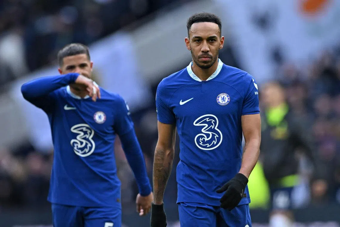 Chelsea's Enzo Fernandez (left) and Pierre-Emerick Aubameyang react to their defeat on the pitch against Tottenham Hotspur, on Feb 26, 2023.