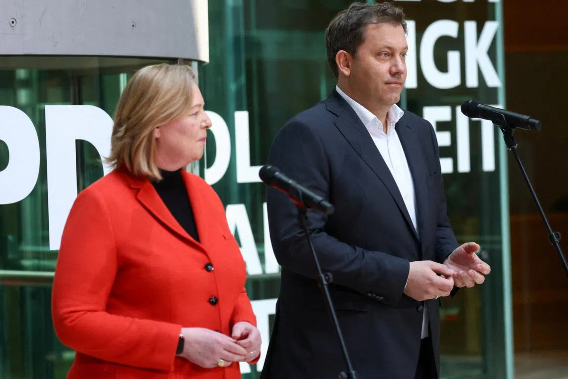 FILE PHOTO: Lars Klingbeil and Baerbel Bas, co-leaders of Germany's Social Democratic Party (SPD), hold a press conference following the Rhineland-Palatinate state election, at the SPD headquarters in Berlin, Germany, March 23, 2026. REUTERS/Christian Mang/File Photo