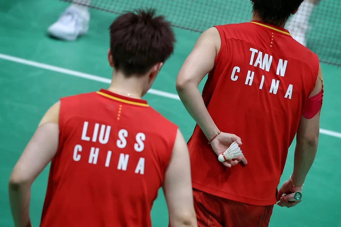 (FOR SPORTS FEATURE, PLEASE DO NOT SHARE OR USE WITHOUT PERMISSION) Tan Ning (right) and Liu Sheng Shu of China communicating with hand signals in their badminton women?s doubles final loss to Lee So-hee and Baek Hana of South Korea at Ichinomiya City Municipal Gymnasium on Sept 29, 2026. ST PHOTO: KEVIN LIM