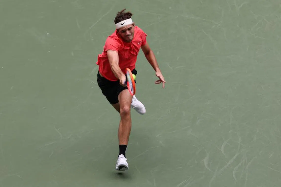 Tennis - U.S. Open - Flushing Meadows, New York, United States - August 28, 2023 Taylor Fritz of the U.S. in action during his first round match against Steve Johnson of the U.S. REUTERS/Shannon Stapleton