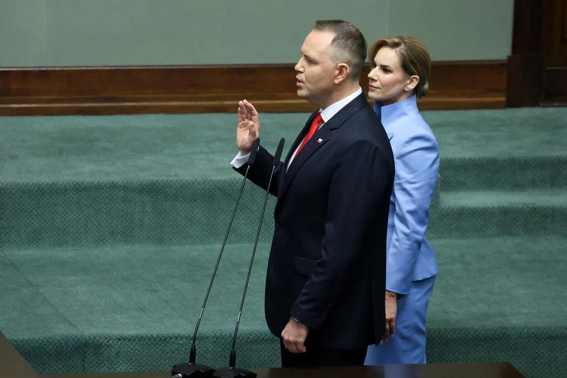 Poland's President-elect Karol Nawrocki is sworn in, at the parliament in Warsaw, Poland, August 6, 2025. REUTERS/Kacper Pempel