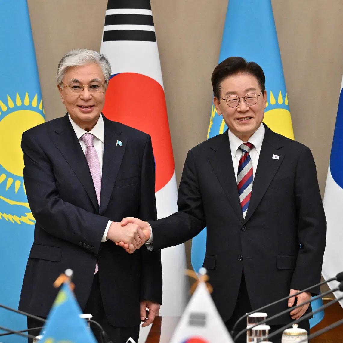 Kazakhstan's President Kassym-Jomart Tokayev shakes hands with South Korea's President Lee Jae Myung during their meeting at the presidential Blue House in Seoul, South Korea September 15, 2026, on the sidelines of the First Korea-Central Asia Summit 2026. JUNG YEON-JE/Pool via REUTERS
