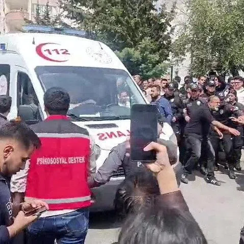An ambulance leaves the scene following a deadly school shooting, in the southeastern province of Kahramanmaras, Turkey, April 15, 2026. IHA (Ihlas News Agency) via REUTERS