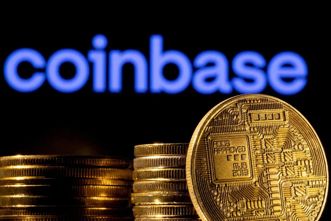 FILE PHOTO: A representation of the cryptocurrency is seen in front of Coinbase logo in this illustration taken, March 4, 2022. REUTERS/Dado Ruvic/Illustration//File Photo