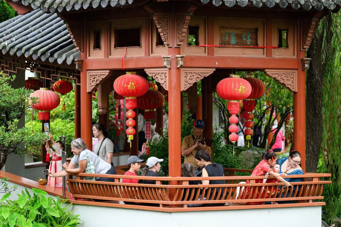 People enjoy the festivities during the Chinese Lunar New Year Opening Ceremony at Darling Harbour in Sydney, Australia, on Jan 29.