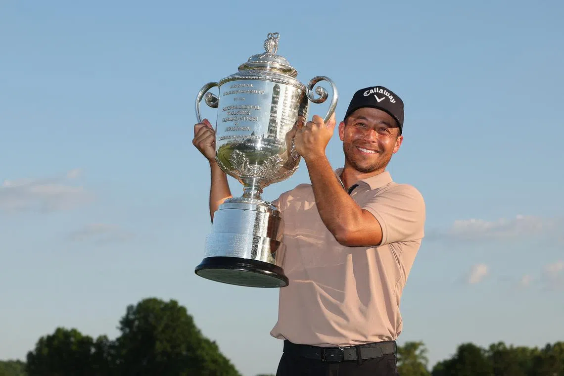 Xander Schauffele of the United States poses with the Wanamaker Trophy after winning the final round of the 2024 PGA Championship on May 19.