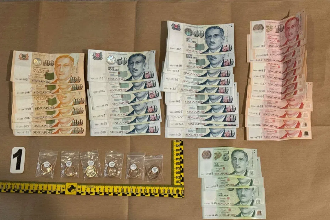 A total of 15 identical counterfeit gold rings, cash amounting to S$1,578, and mobile phones containing fabricated transaction receipts were seized as case exhibits.
