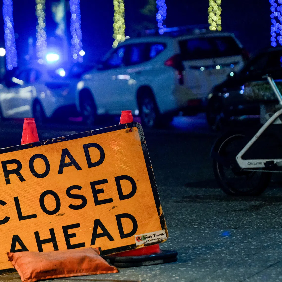 A sign at the scene of a shooting incident at Bondi Beach, Sydney, Australia, December 14, 2025. REUTERS/Izhar Khan