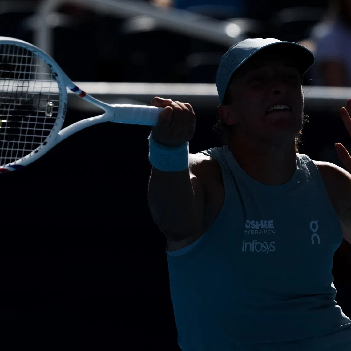 Aug 22, 2026; Mason, OH, USA;  Iga Swiątek (POL) returns a shot against Jessica Pegula (USA) during the Cincinnati Open at Lindner Family Tennis Center. Mandatory Credit: Aaron Doster-Imagn Images