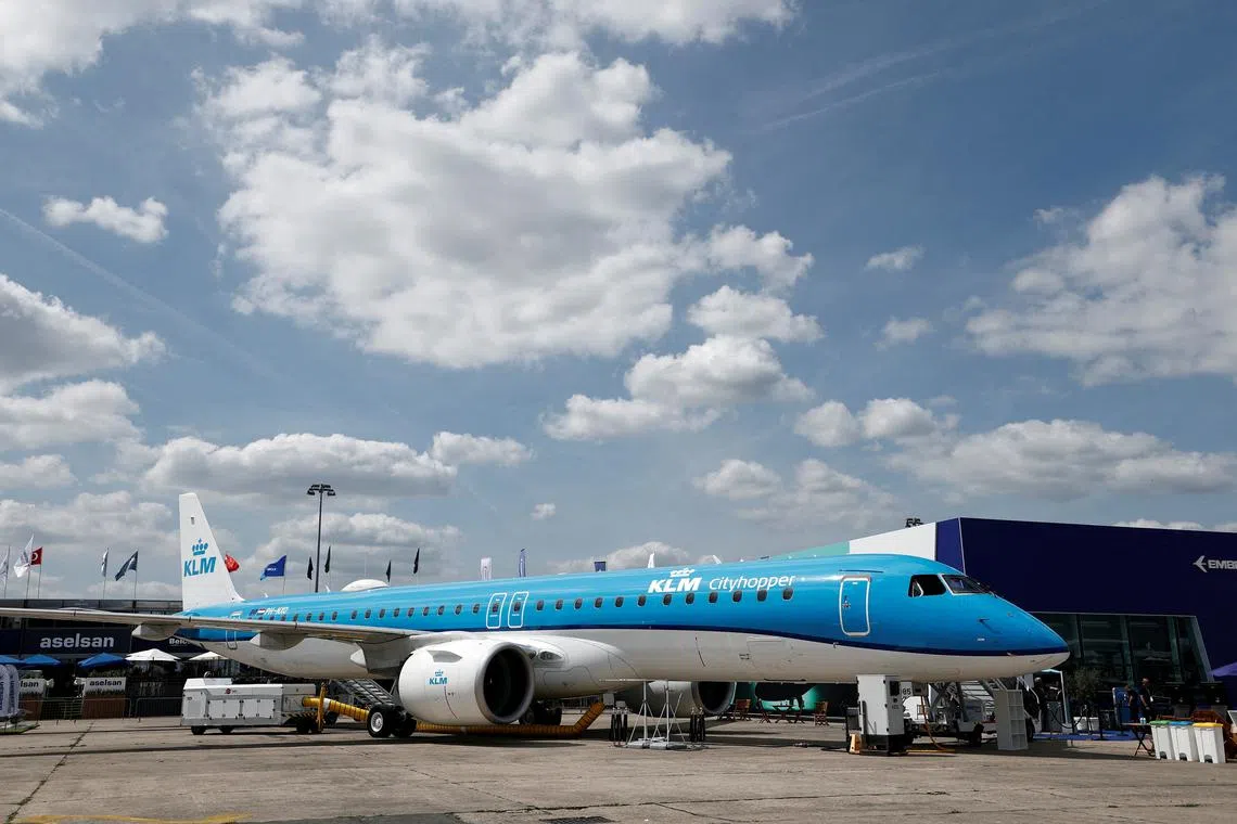 FILE PHOTO: A KLM Embraer E195-E2 aircraft is displayed at the 55th International Paris Airshow at Le Bourget Airport near Paris, France, June 16, 2025. REUTERS/Benoit Tessier/File Photo