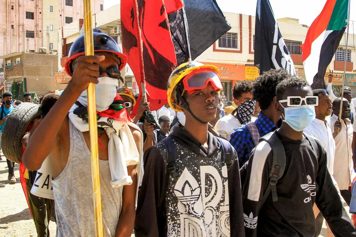 Protesters marching during an anti-government demonstration in the Sharoni area in the north of Sudan's capital Khartoum on March 14.