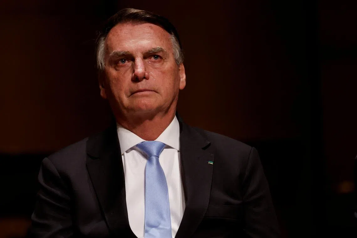 FILE PHOTO: Brazil's former President Jair Bolsonaro reacts at an event at the Municipal Theatre in Sao Paulo, Brazil March 25, 2024. REUTERS/Amanda Perobelli/File Photo
