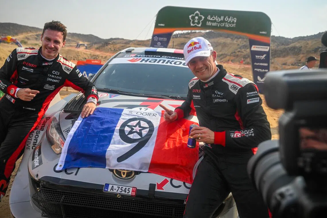 Sebastien Ogier (right) and co-driver Vincent Landais of France, competing with their Toyota GR Yaris Rally1, celebrating after winning the 2025 World Rally Championship title after the WRC Rally Saudi Arabia in Jeddah on Nov 29, 2025.