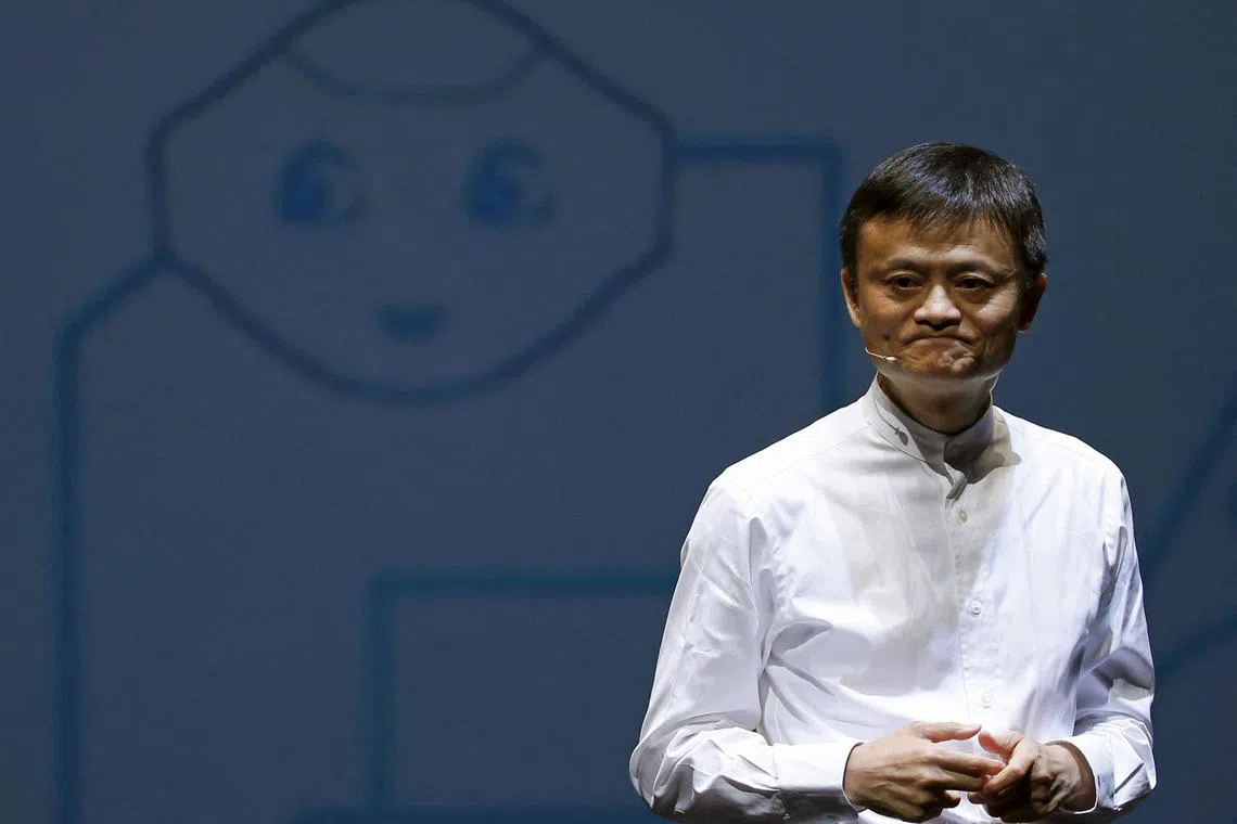 Jack Ma, founder and executive chairman of China's Alibaba Group speaks in front of a picture of SoftBank's human-like robot named 'pepper' during a news conference in Chiba, Japan, June 18, 2015. Japan's Japan's SoftBank Corp said on Thursday it is setting up a joint venture with Chinese online shopping giant Alibaba and electronics supplier Foxconn Technology to sell its human-like robot Pepper around the world. REUTERS/Yuya Shino