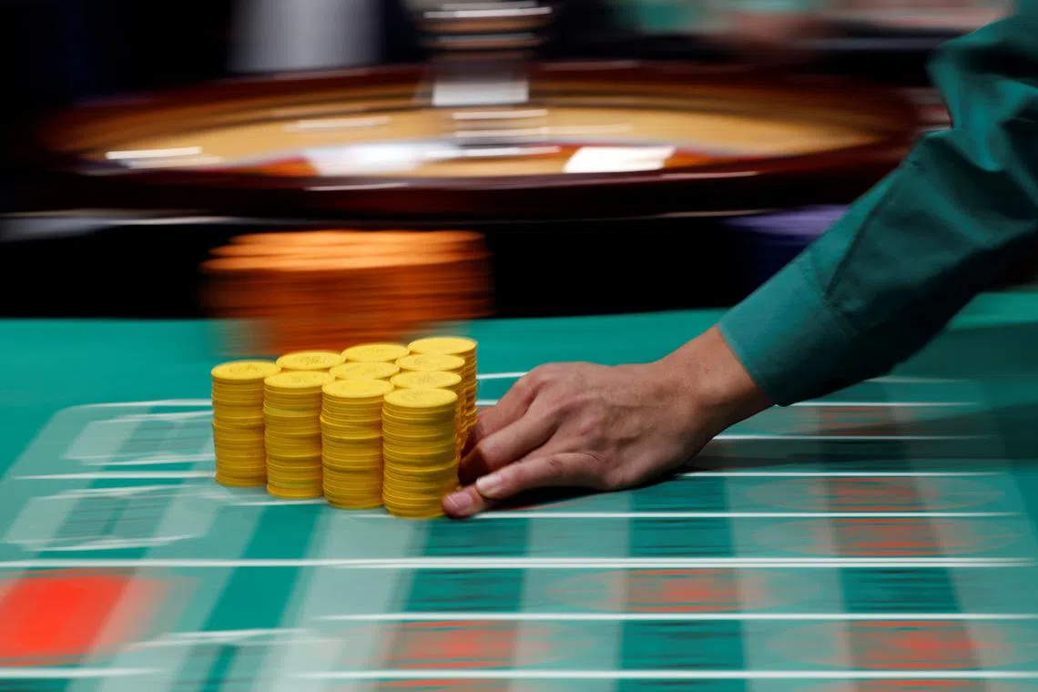 FILE PHOTO: Instructor Daisuke Sato moves chips on a roulette table at Japan Casino School in Tokyo, Japan August 4, 2018. REUTERS/Toru Hanai/File Photo