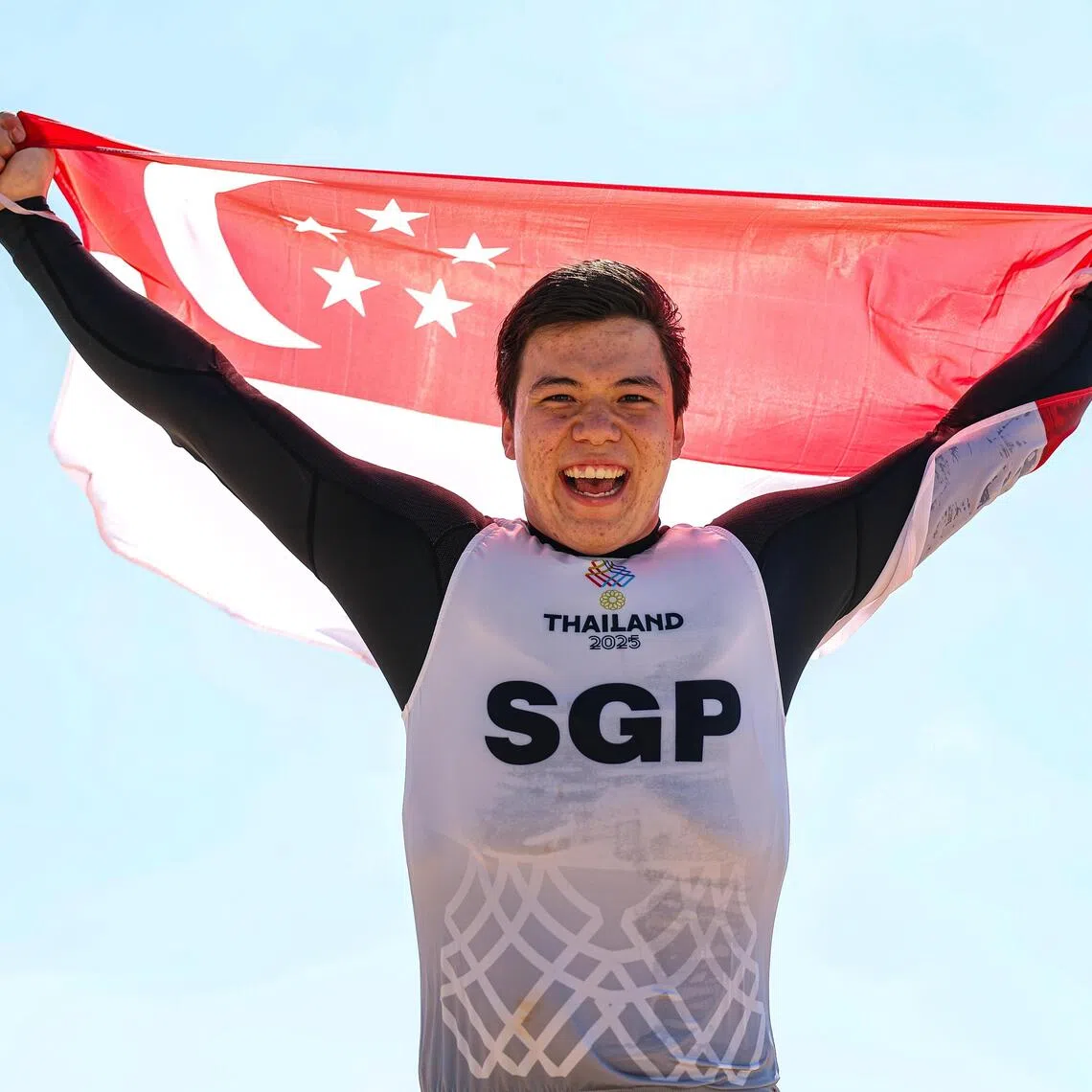 Singaporean kitefoiler Max Maeder celebrating on shore after winning the last round of the men's kiteboarding formula kite at the SEA Games, held at the Ambassador City Jomtien Hotel in Chonburi on Dec 16, 2025. 
