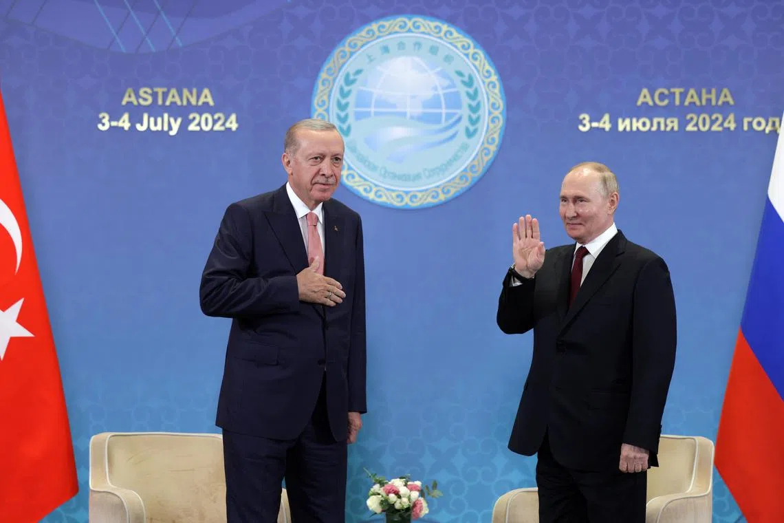 Turkish President Recep Tayyip Erdogan (left) and Russian President Vladimir Putin meeting on the sidelines of the Shanghai Cooperation Organisation summit.