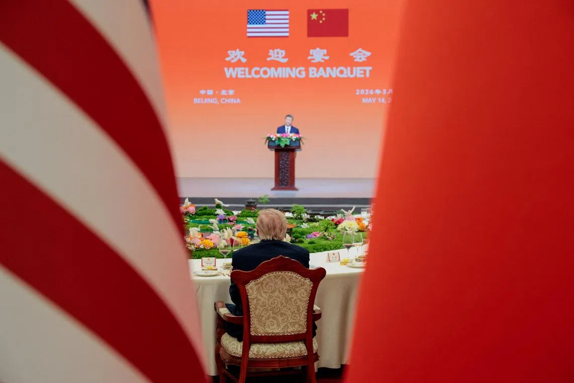 US President Donald Trump sitting as Chinese President Xi Jinping speaks at a state banquet at the Great Hall of the People in Beijing, China, May 14.