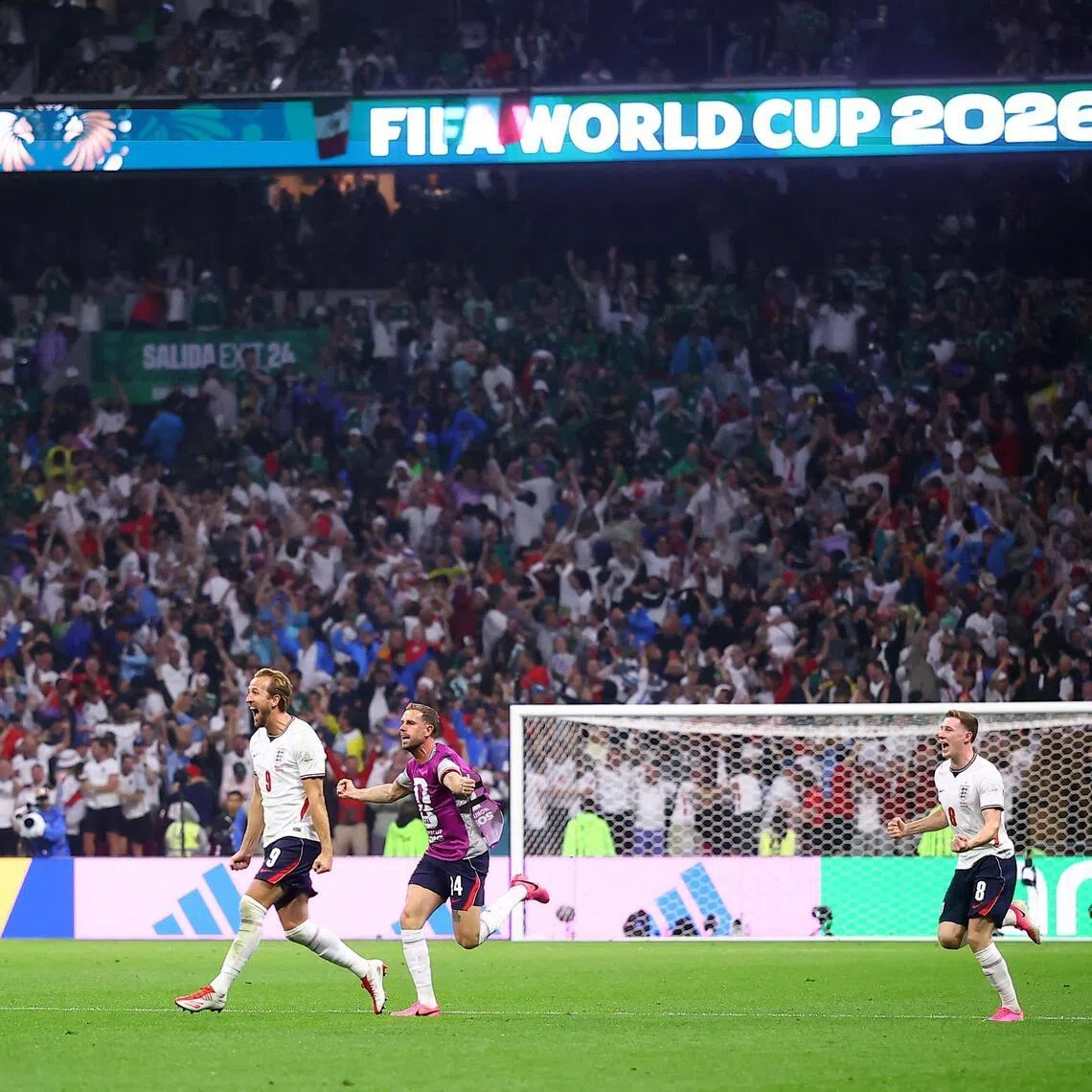 England’s Harry Kane, Jordan Henderson and Elliot Anderson celebrate after the match against Mexico.