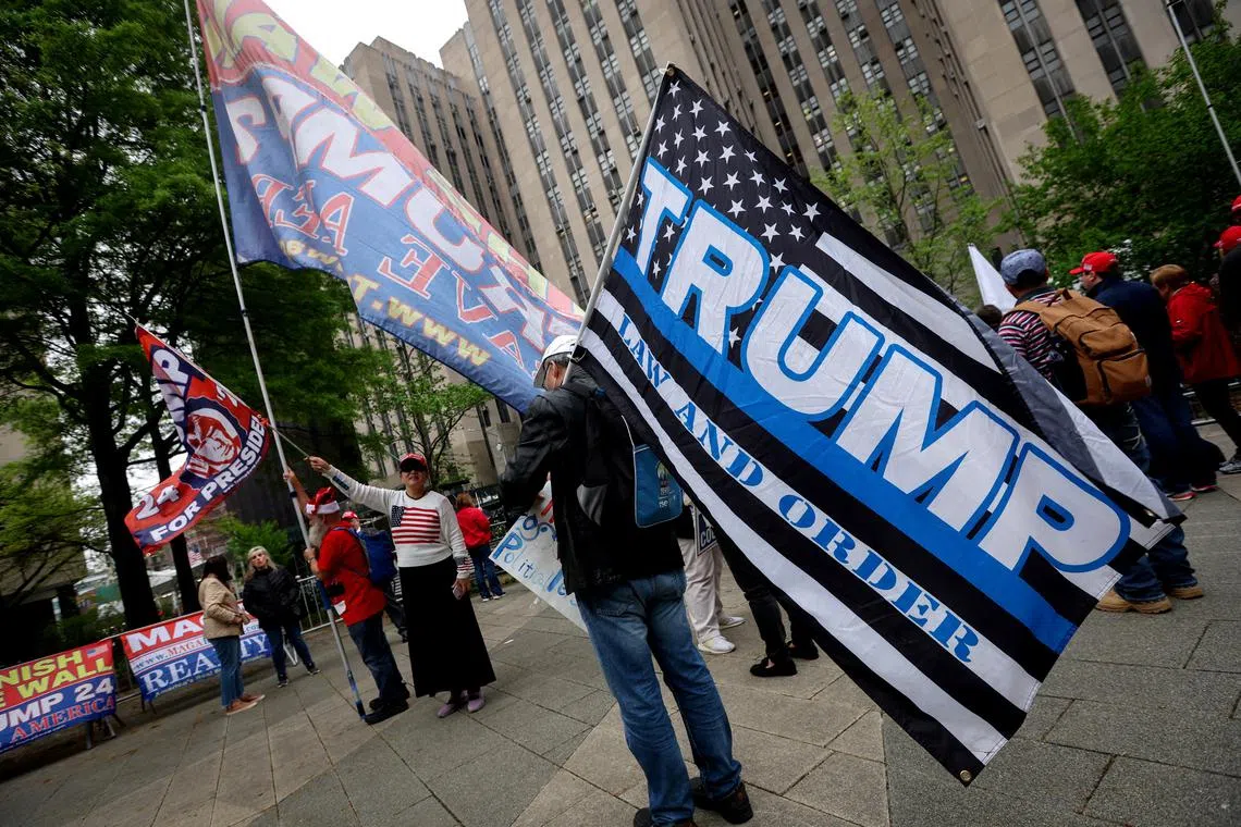 Supporters of former U.S. President Donald Trump rally outside Manhattan Criminal Court during Trump’s trial over charges that he falsified business records to conceal money paid to silence porn star Stormy Daniels in 2016 continues, in New York City, U.S., April 30, 2024. REUTERS/Mike Segar