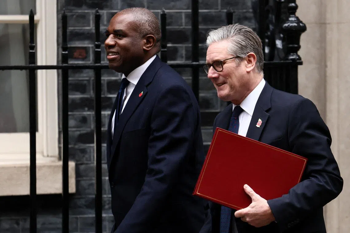 British Prime Minister Keir Starmer leaves 10 Downing Street next to deputy Prime Minister David Lammy, in London, Britain, October 29, 2025. REUTERS/Jack Taylor/File Photo