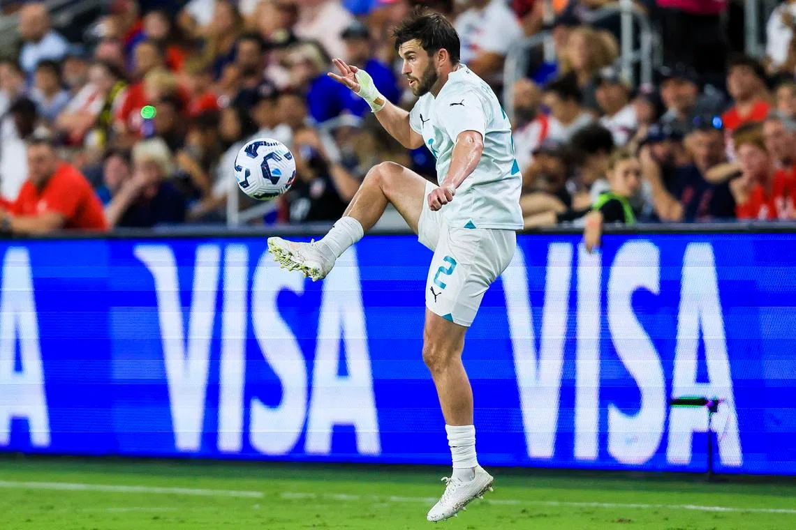 Sep 10, 2024; Cincinnati, Ohio, USA; New Zealand defender Tim Payne (2) kicks the ball against the USA in the second half at TQL Stadium. Mandatory Credit: Katie Stratman-Imagn Images