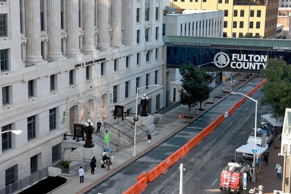The front of the courthouse was lined with rows of orange plastic barriers and steel crowd control barricades.