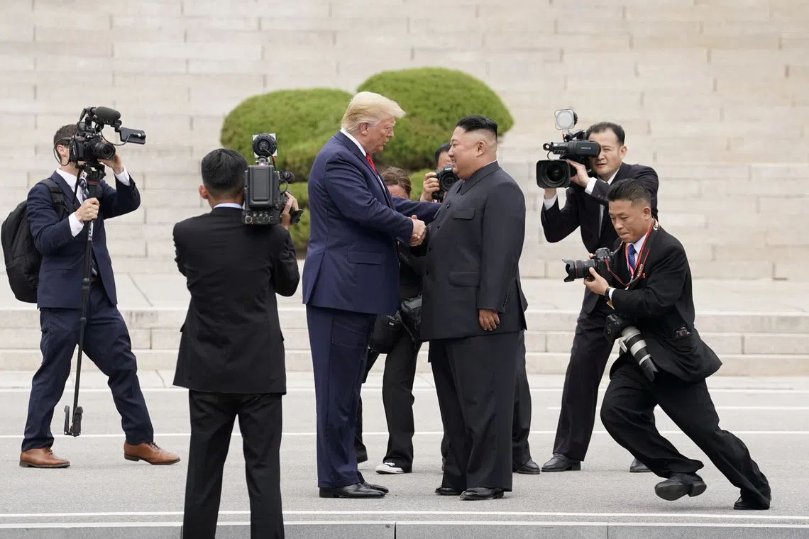 U.S. President Donald Trump meets with North Korean leader Kim Jong Un at the demilitarized zone separating the two Koreas, in Panmunjom, South Korea, June 30, 2019. REUTERS/Kevin Lamarque/File Photo