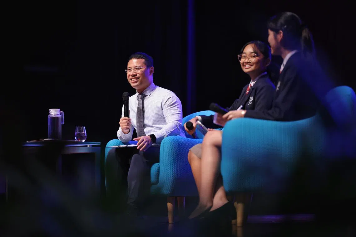 Minister for Education Desmond Lee (left) speaking at the Pre-University Seminar 2025 Closing Ceremony on June 5.